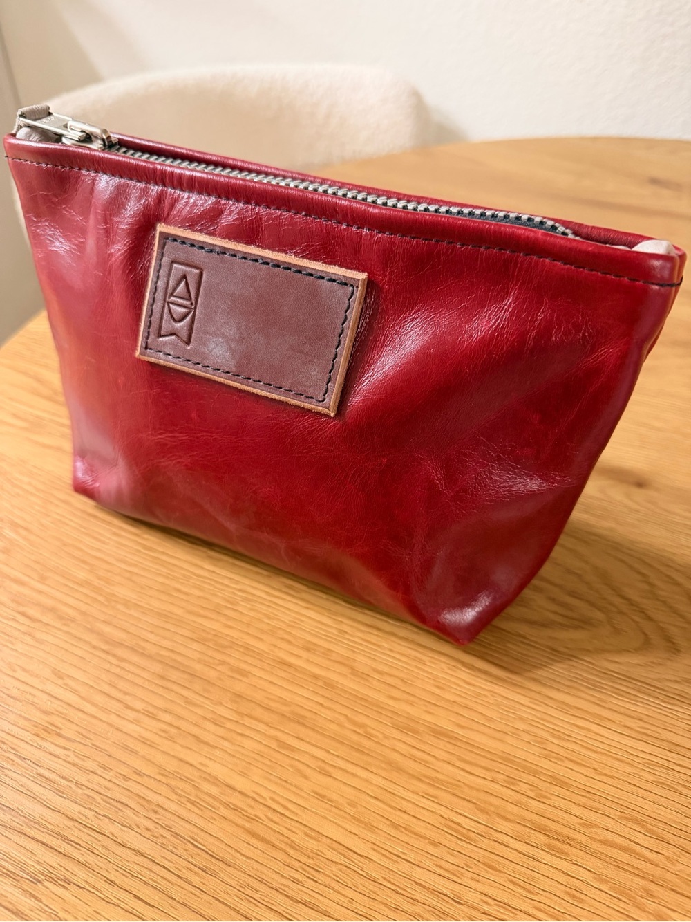 Red Leather Wristlet Clutch with Brown Logo Patch